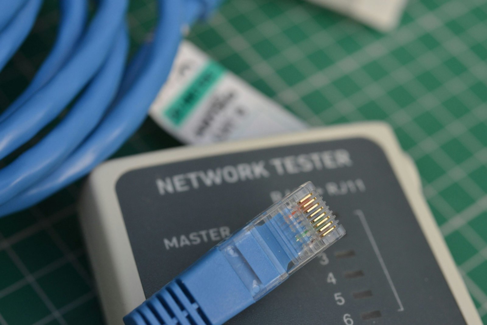 A close up of a network tester on a table